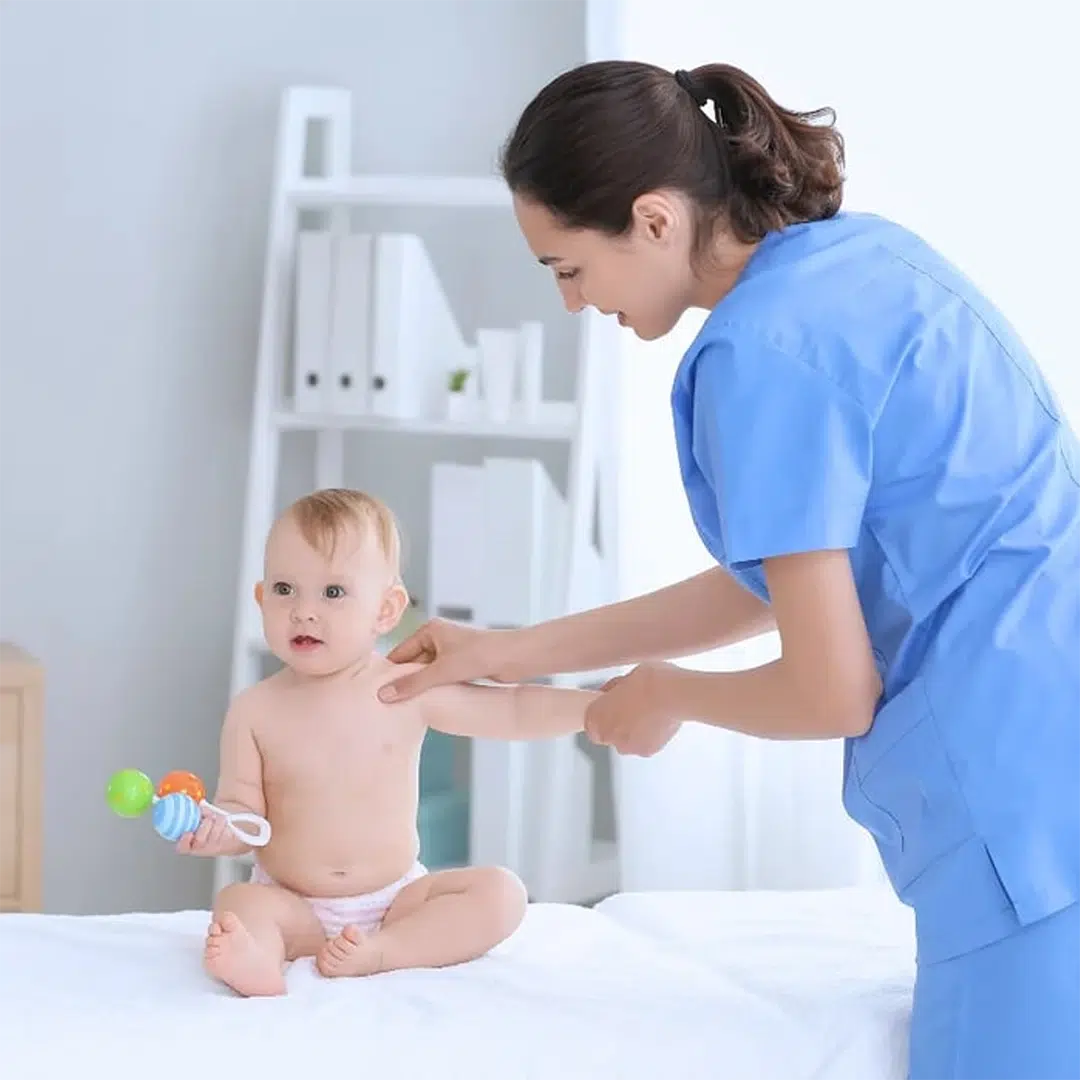 Infant receiving chiropractic treatment for shoulder pain in Tampa FL Infant receiving chiropractic treatment for shoulder pain in Tampa FL